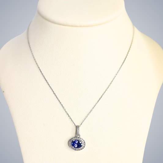 0.50ct Tanzanite and Diamond Halo Pendant in 9ct White Gold