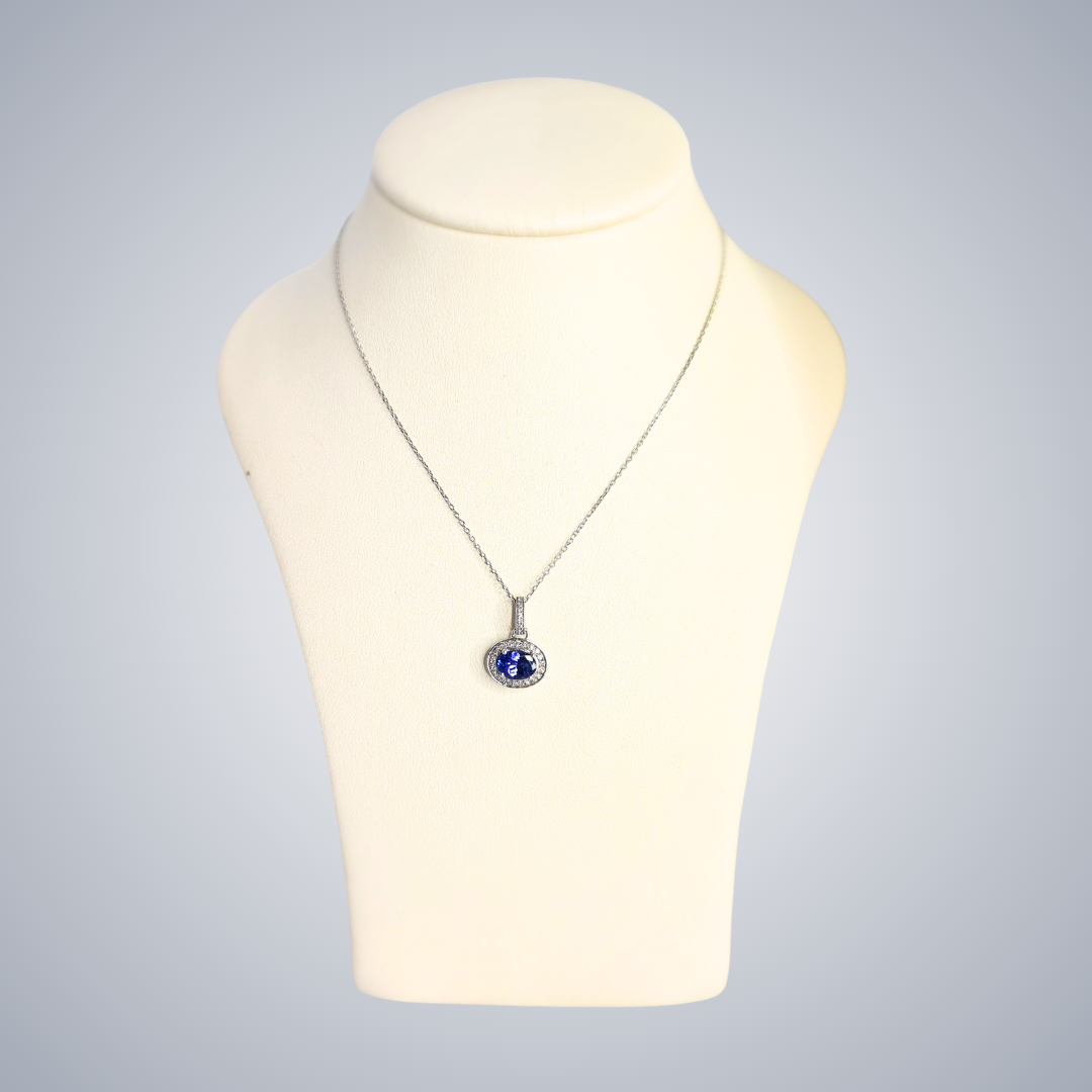 0.50ct Tanzanite and Diamond Halo Pendant in 9ct White Gold