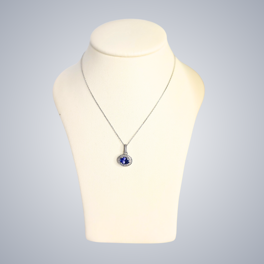0.50ct Tanzanite and Diamond Halo Pendant in 9ct White Gold