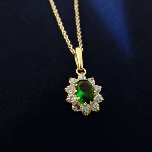 0.70ct Created Emerald Oval Claw set Halo Pendant in 9ct Yellow Gold.