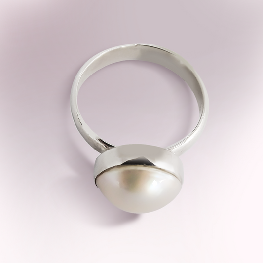 A single Mabe pearl set in a tube set ring in 925 Sterling Silver