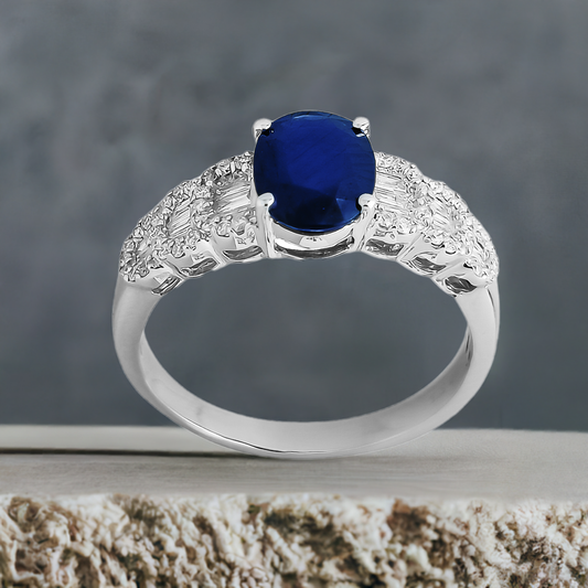 Oval Sapphire and Tapered Baguette Diamond Halo Ring in 9ct White Gold