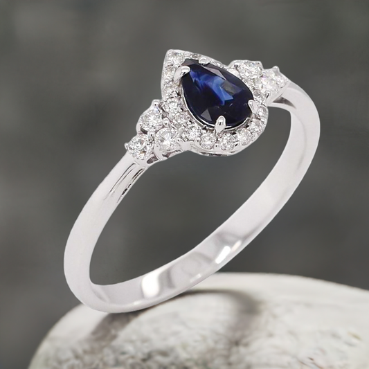 0.45ct Sapphire and Diamond Pear Shaped Halo Design Ring in 9ct White Gold