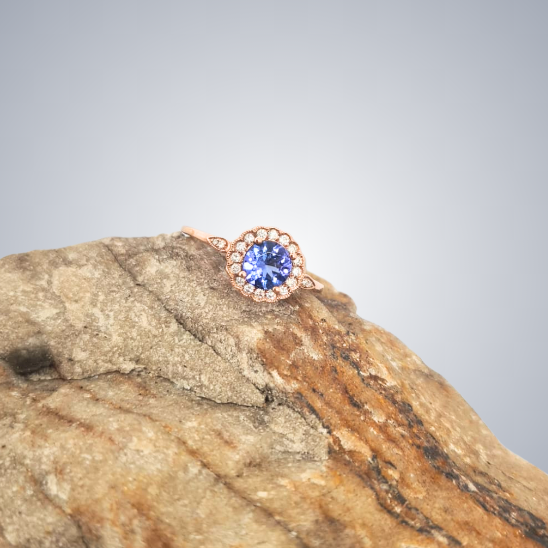 0.70ct Tanzanite and Diamond Halo Ring in 9ct Rose Gold