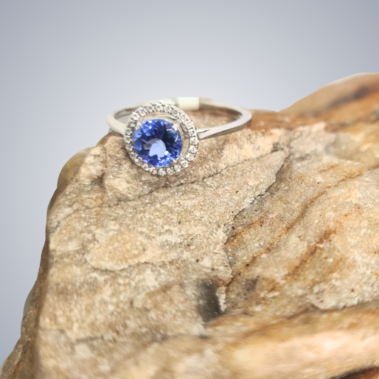 0.87ct Tanzanite and Diamond Halo Ring in 14ct White Gold