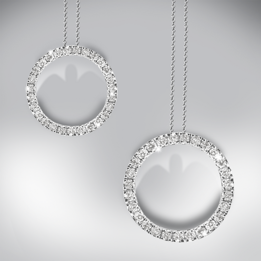 Two diamond circle pendants on a gray background
