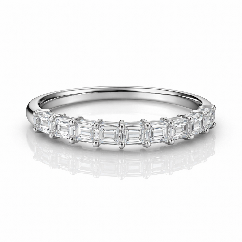 Silver ring with baguette-cut diamonds on a white background