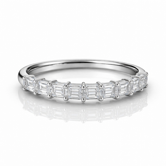 Silver ring with baguette-cut diamonds on a white background
