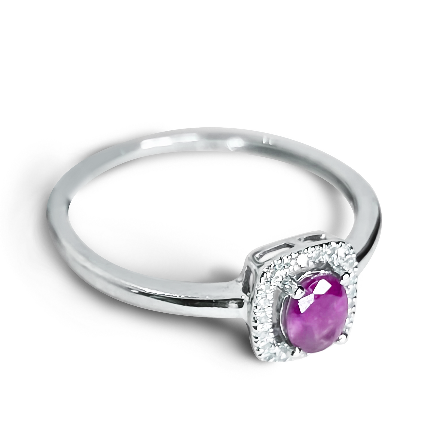 Oval Ruby and Diamond Halo Wedding Ring in 9ct White Gold